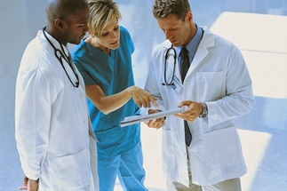 Team of doctors pondering a patient problem
