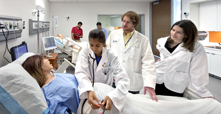 medical student practicing with simulation model
